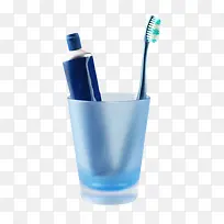 蓝色塑料杯子里的牙膏和牙刷-空若网 蓝色塑料杯子里的牙膏和牙刷-空若网