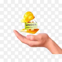 手心里的黄色安全帽-空若网 手心里的黄色安全帽-空若网